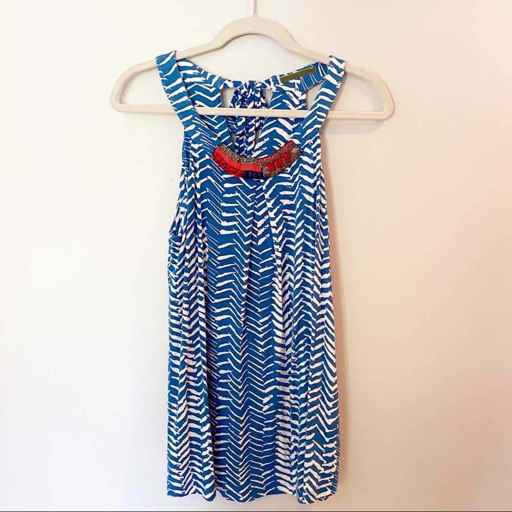 Blue and white halter top with beaded detail.